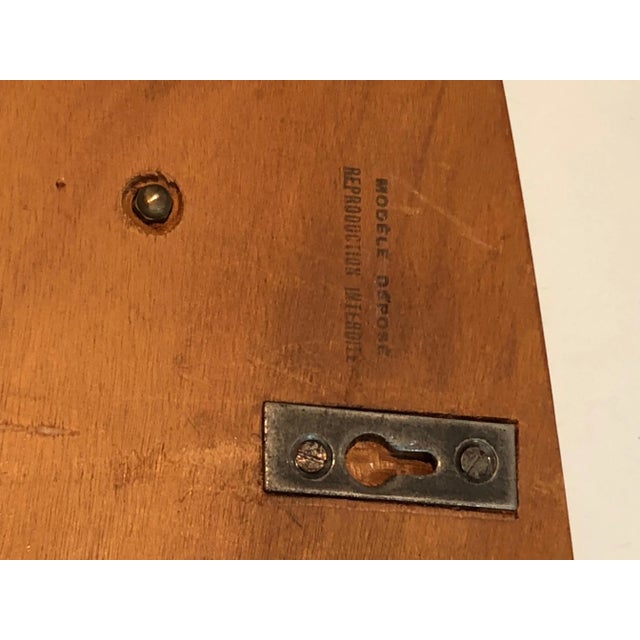 This very nice shelves unit is made of wood, rattan and lacquered metal. This is a French work signed by Raymond Glemeau,...