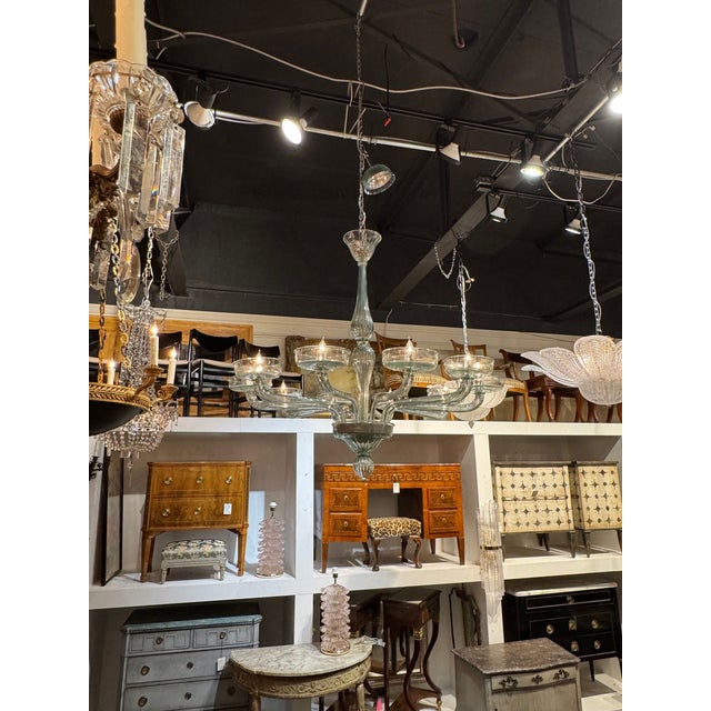 The Murano Fontana Green Chandelier is a stunning piece of lighting that exudes elegance and style. The beautiful color...