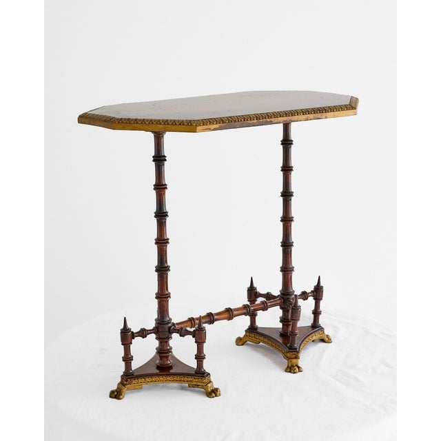 A refined Aesthetic Movement occasional table in the Anglo-Japanese taste, dating to the late 19th century, circa...