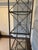 This beautiful etagere was purchased at the San Francisco Pierre Deux store. It is made of pewter-looking metal and glass....