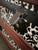 Antique Steamer Trunk Dome Top Embossed Metal Finish With Wheels For Sale - Image 9 of 10