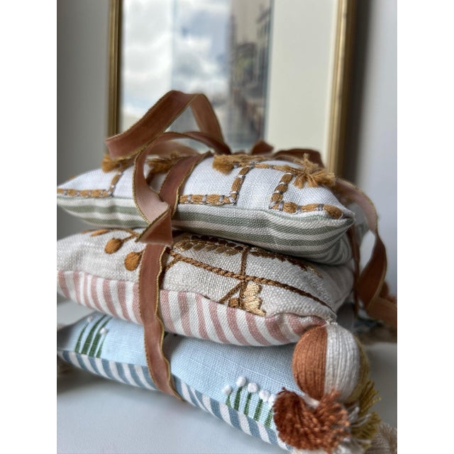 Set of three decorative pillows filled with fragrant dried lavender. Pretty enough to display, then can also be tucked...