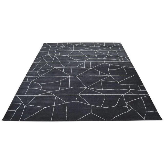 Moroccan Azilal hand knotted wool rug with abstract design.