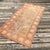 A Distressed Vintage Gördes Rug with Double Nich Design This vintage Anatolian Gördes rug is hand-knotted in Turkey...