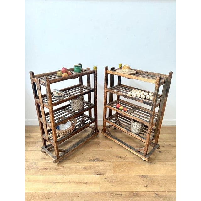 Early 20th century pair of bakers trolleys, four tier and on castors. Everything present and in working condition, though...