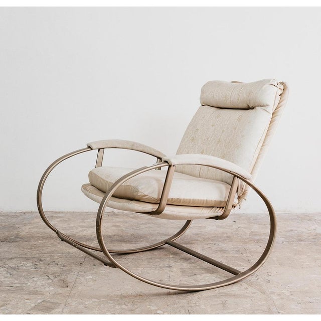 Rocking Armchair ATTR. Guido Faleschini 1970s Hollywood Regency Design. All-metal structure painted gold. Vain-colored...