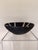 Bring sculptural texture to your home with this contemporary decorative wall bowl, crafted from ceramic with a beautifully...