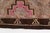 This is a vintage Turkish Oushak rug from the Mid 20th Century. The piece was hand-knotted.