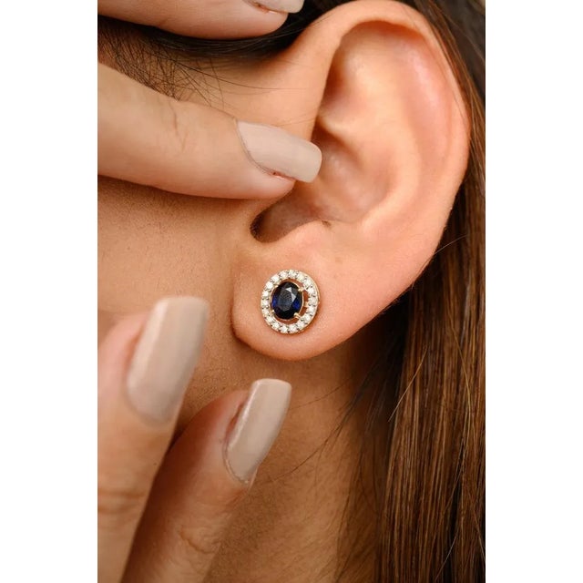 This is part of Chairish’s Fine Jewelry assortment. Blue Sapphire Halo Diamond Everyday Stud Earrings for Mom in 14K Gold...