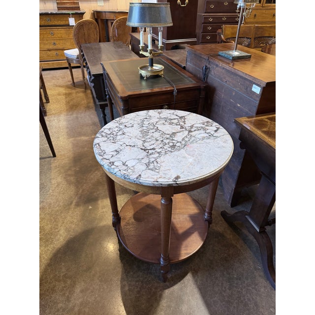 beautifully proportioned vintage Louis XVI style side table that brings together the restrained ornamentation and...