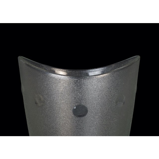 Polka dots glass vase is a wonderful decorative object, realized by an italian manufacture during the 1970s. Very elegant...