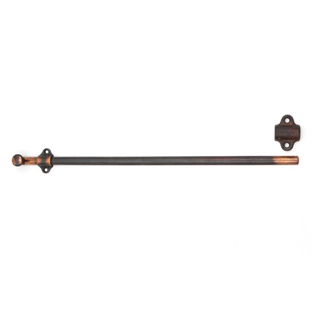 Japanned finish steel surface door bolt with an unusually long latch. The original mounting screws are not available. Good...