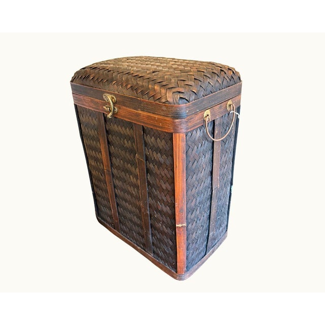 Large antique Japanese bamboo storage trunk with hinged lid, brass latch, brass ring handles, and bamboo frame trim. Dark...
