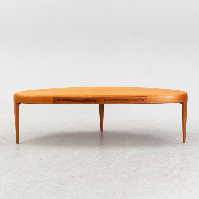 Johannes Andersen for Trensum, coffee table in teak wood, model Capri. Curved form, double drawer in the apron, three...