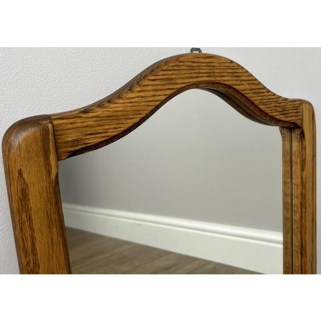 Add timeless charm to your home with this elegant Vintage French wall mirror, crafted from oak and featuring a gently...
