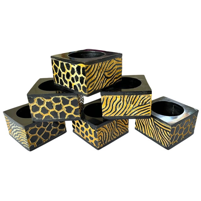 Striking set of six hand-carved wooden napkin rings. Crafted from solid wood with a black lacquered finish, each square...