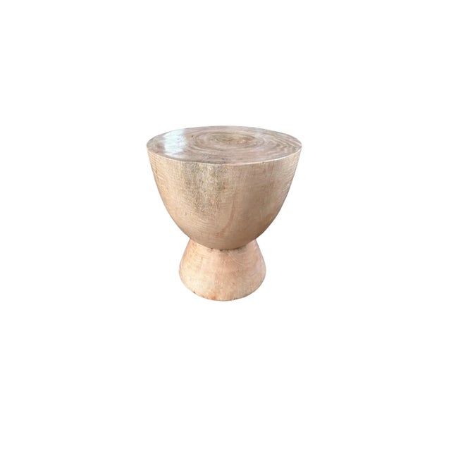 This wonderfully sculptural round side table features a bleached finish, providing a washed out tone to the wood. The...
