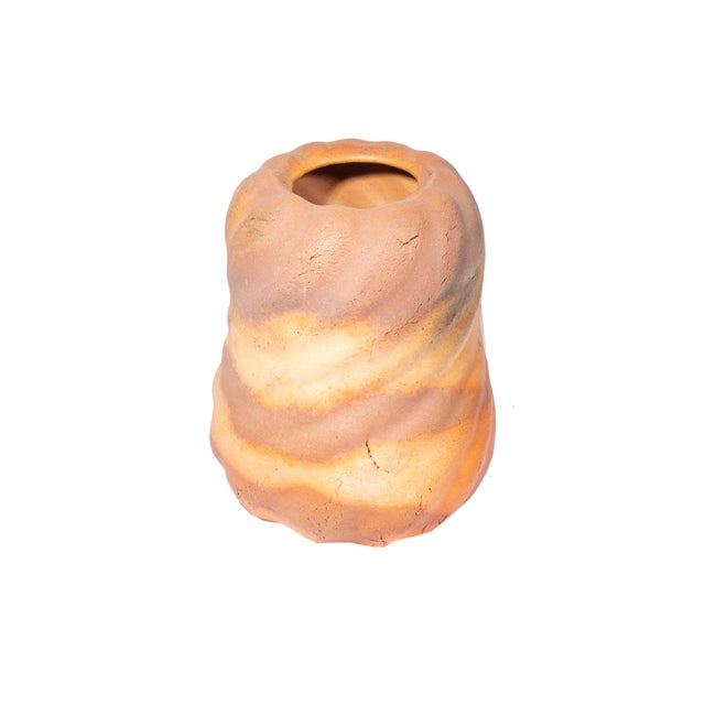 A two tone vintage studio pottery vase. This gourd-shaped vase has a raised spiral design. The vase is unmarked.