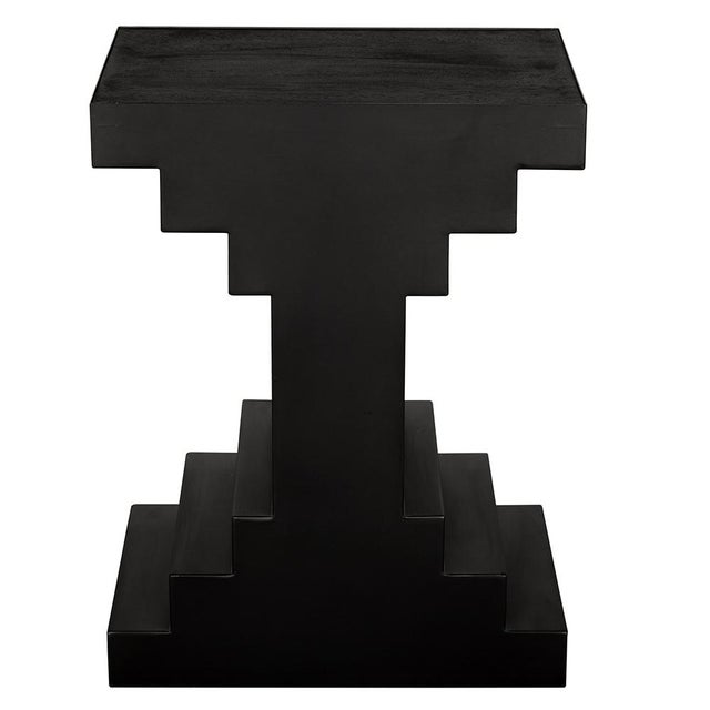This geometric black side table showcases a stepped, architectural silhouette that draws inspiration from Brutalist and...