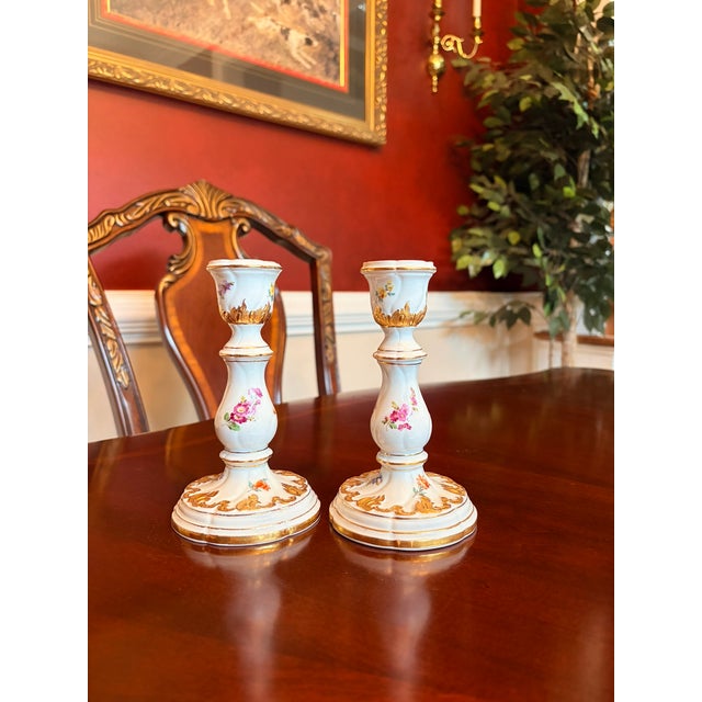 Elegant and highly collectible pair of antique Meissen porcelain candlesticks crafted in Germany during the late 19th...
