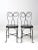 Here is a pair of ice cream parlor chairs circa early 20th century. The vintage wrought iron chairs feature a classic...