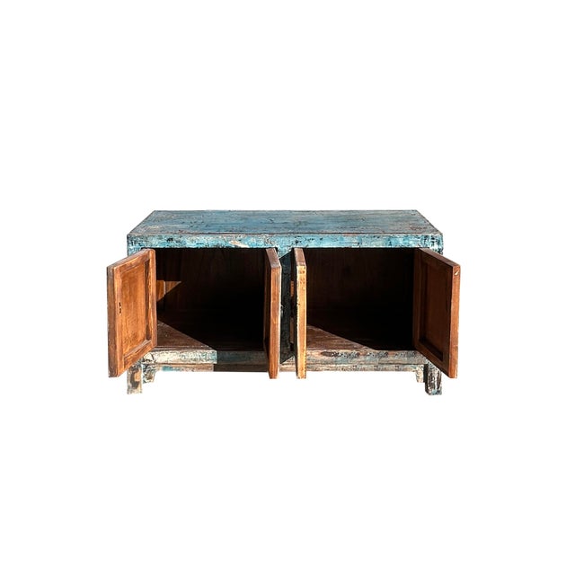 This Distressed Teal Chinese-Inspired TV Stand is a stylish and functional addition to any living room. The unique teal...
