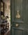 A charming late 20th-century door knocker cast in brass and modeled as a pair of crossed tennis rackets with a dimensional...