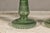 A near pair of green glass gas lights with meander friezes. Discover the unique charm and historical allure of this near...