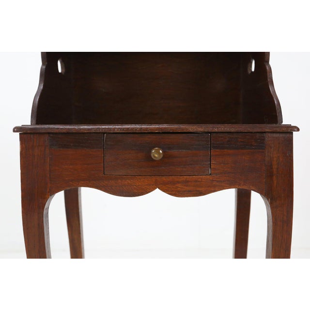 France / 1900 / Nightstand / wood / Antique / Romanic Elegant richly molded Louis XV style nightstand in solid oak, hand...
