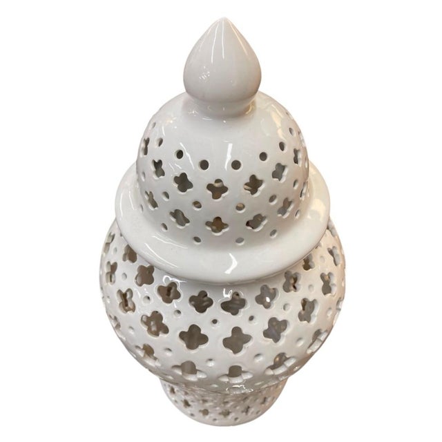 Add a touch of timeless elegance and warm ambience to your home with this exquisite vintage pierced white ceramic...