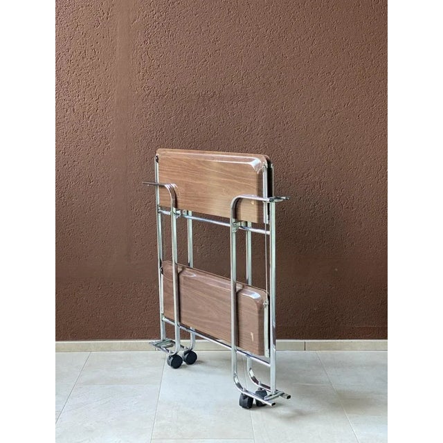 Multipurpose trolley in the style of the Dinett of Bremshey Solingen, authentic vintage. In chromed metal and brown...