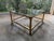 Stylish vintage Hollywood Regency style circa 1970s Mastercraft brass and glass coffee table. Has a square beveled glass...