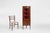A refined French corner display cabinet crafted in the Louis XV style, dating from around 1950. The piece features a...