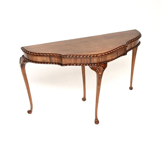 A beautiful antique Queen Anne style figured walnut console table. This was made in England, it date from around the...