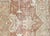 This semi-antique Persian Heriz rug, measuring 9'9" by 11', is handwoven in Iran's Mahal region and has been carefully...