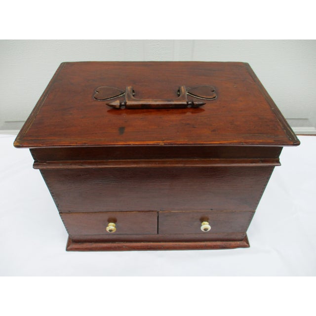 This beautifully handcrafted jewelry or trinket box features fine joinery along the sides, three storage compartments, and...