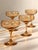 Classy and elegant set of smoked amber champagne coupe glasses featuring beautifully etched detailing throughout. The warm...