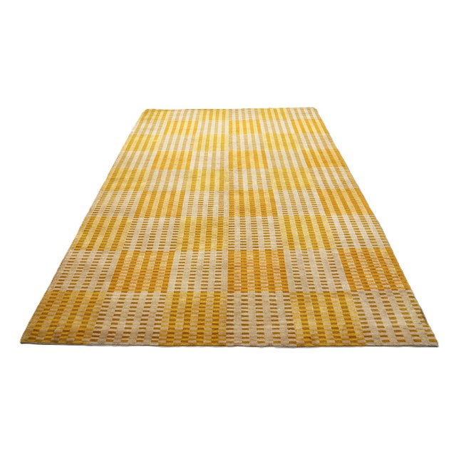 A vibrant expression of modern textile art, this 6'x9' hand-knotted rug combines dynamic geometric design with traditional...