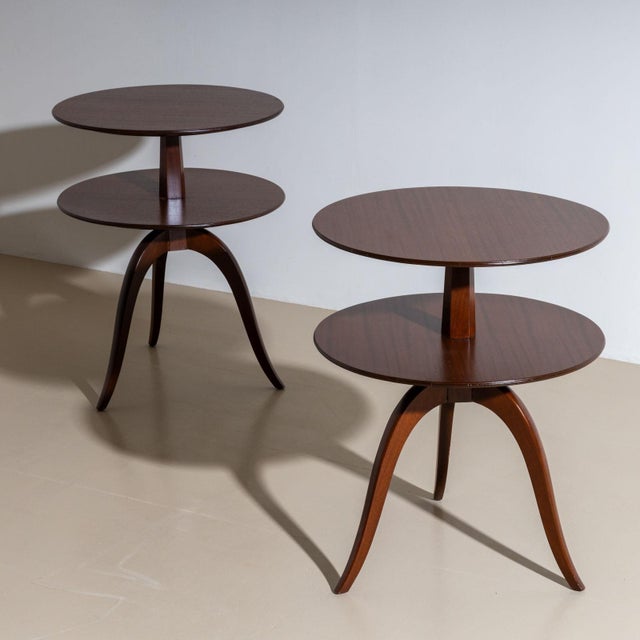 A pair of elegant side tables designed by Edward Wormley (USA, 1907–1995) for Dunbar, crafted in the mid-20th century. The...
