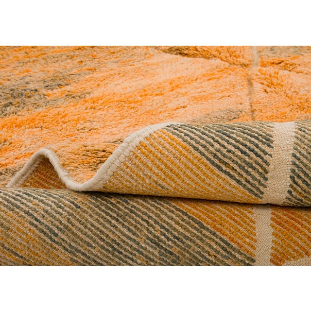 Warm horizontal bands of burnt orange, taupe, and olive shift across the surface like layered desert strata, crossed by a...