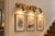 Add a refined architectural touch to your bathroom, dressing area, or interior wall with this handcrafted brass 3-light...