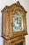 A charming Vintage French grandfather clock crafted in oak with elegant traditional styling and beautiful decorative...