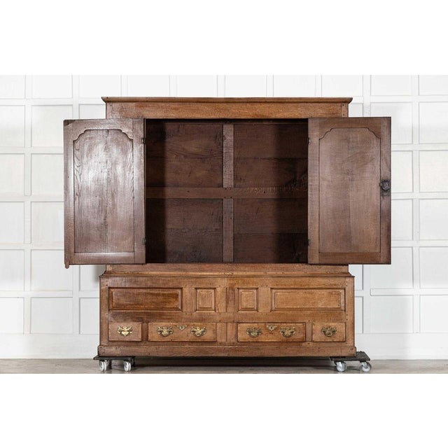 Circa 1790 large 18thc english oak livery cupboard together w198 x d52 x h202 cm base w198 x d52 x h63 cm top w193 x d50 x...