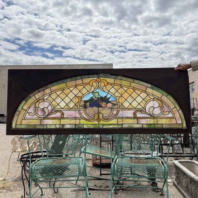 Antique Art Nouveau Multi Colored Stained Glass "Harvest Scene" Arched Transom Window in Wooden Frame (B). Listing is for...