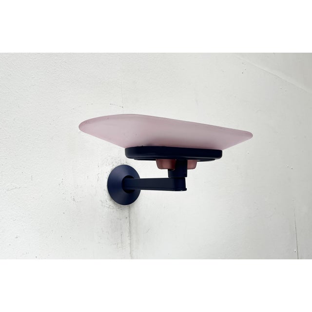 Postmodern Jill wall lamp from the Italian manufacturer Arteluce (Flos) in the rare color combination pink and blue. The...