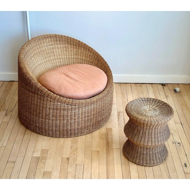 Timeless sculptural rattan "Elephant Boot" chair and “Juttu” stool, designed by Eero Aarnio for Stendig. Tactile wicker...