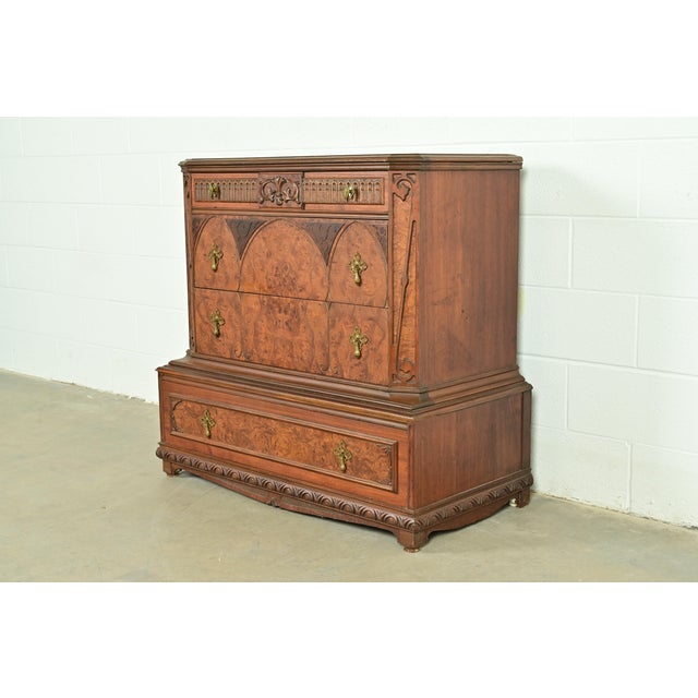 A beautiful antique Victorian or Gothic Revival chest of drawers or dresser In the manner of Berkey & Gay USA, Circa 1930s...