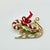 A lovely Christmas Brooch from the 1960s. It features a gold tone Santa Sleigh with green holly and red berries accent. In...