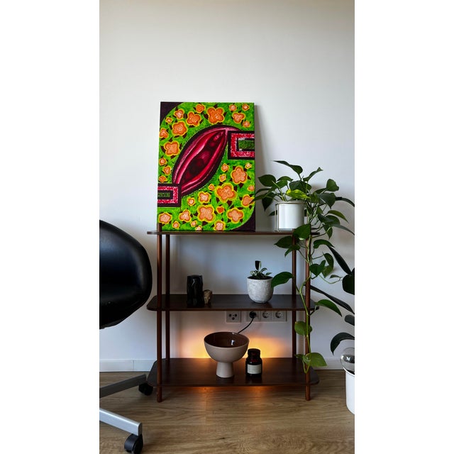 This piece is a striking celebration of nature, femininity, and transformation, evoking a sense of fertile vitality and...