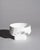 A sculptural porcelain bowl designed by Zaha Hadid for Rosenthal, translating the architect's signature language of fluid...